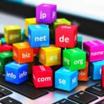 Image is showing lots of colorful cubes. each of them is holding a TDL like : com, org, net, etc - Domain Name 101: A Beginner's Guide to Choosing the Perfect Domain Name