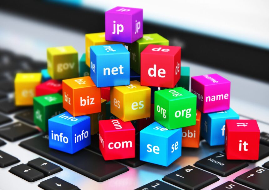 Image is showing lots of colorful cubes. each of them is holding a TDL like : com, org, net, etc - Domain Name 101: A Beginner's Guide to Choosing the Perfect Domain Name